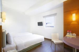 Krevet ili kreveti u jedinici u okviru objekta Amaris Hotel Madiun