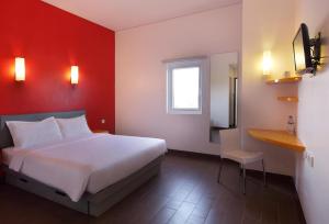 Krevet ili kreveti u jedinici u okviru objekta Amaris Hotel Madiun