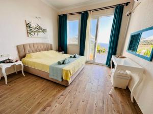 Postel nebo postele na pokoji v ubytování Goknar Knidos Eco Farm & Hotel + 37 fotografií