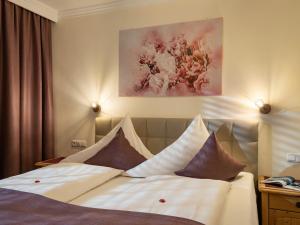 A bed or beds in a room at Appartements Fortuna