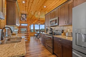 a kitchen with wooden floors and wooden ceilings at Dolly Valley View in Sevierville