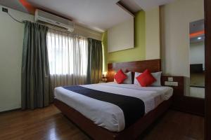 Katil atau katil-katil dalam bilik di Collection O Salasar Palace
