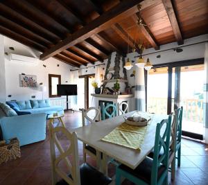 a kitchen and living room with a table and chairs at Villa Krio Pigadi in Kechria +12 photos