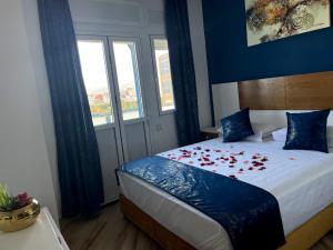 Voodi või voodid majutusasutuse HOSTAL MH BORJ toas