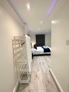 a room with a room with a bed and a ladder at Stylish En Suite double room Kensington in London