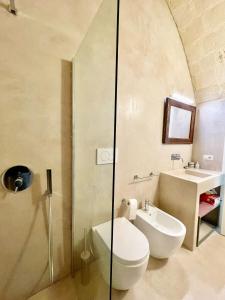 a bathroom with a shower and a toilet and a sink at Casa Maricla - Marea Collection in Otranto