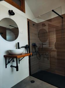 a bathroom with a sink and a shower at La Madriguera Eco Caves 3 in Guadix +9 photos