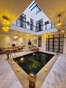 a house with a pool in the middle of it at RIAD NOLITA & SPA Kasbah in Marrakech