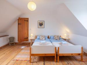 a bedroom with two beds in a attic at Little Wells 6 in North Creake