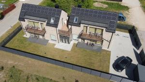 an overhead view of a house with solar panels on it at SALIA KOPU 2 in Klaipėda
