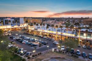 a parking lot with cars parked in a city at Pohaku Paea Studio suite.nui in Chandler