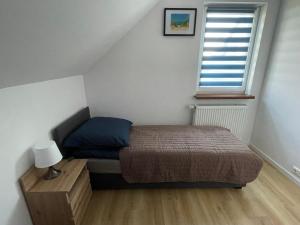 Postel nebo postele na pokoji v ubytování Całoroczny domek - bliźniak