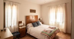 Postel nebo postele na pokoji v ubytování Casa Quebraero Caminito del Rey