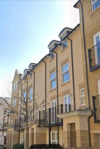 a large building with balconies on the side of it at Sapphire Apartment Bromley Common in Bromley