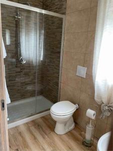 a bathroom with a toilet and a shower at Vista Mare - Case Vacanza in Taranto +22 photos