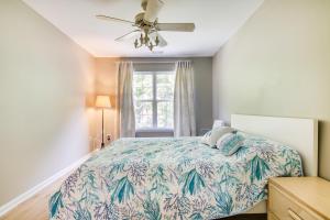 a bedroom with a bed and a ceiling fan at Charming Lewes Townhome with Sunroom 5 Mi to Beach! in Lewes