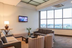 TV a/nebo společenská místnost v ubytování Monreale Plus Guarulhos International Airport
