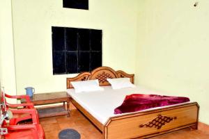 Cama o camas de una habitación en SPOT ON Hotel Durga