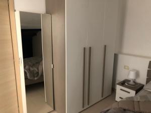 Postel nebo postele na pokoji v ubytování Mansarda mentana