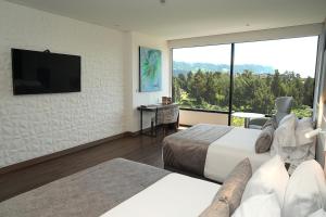 TV a/nebo společenská místnost v ubytování Hotel Sabana Park