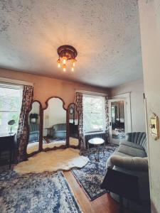 a living room with a couch and a table at Marianna Stoltz House in Spokane