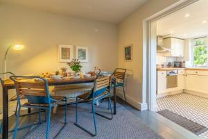 a kitchen and dining room with a table and chairs at Willow Cottage 2 in North Creake