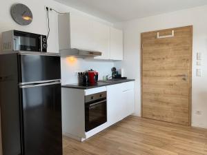 Kuchyň nebo kuchyňský kout v ubytování Frundsberg-Apartment