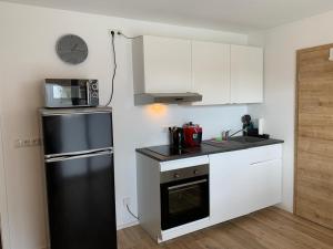 Kuchyň nebo kuchyňský kout v ubytování Frundsberg-Apartment