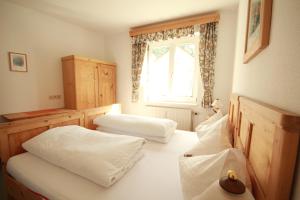 Postel nebo postele na pokoji v ubytování Appartement Dachsteingasse by Schladming-Appartements + 19 fotografií