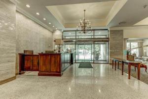 a large living room with a table and a dining room at Cozy View Downtown Atlanta Condo in Atlanta