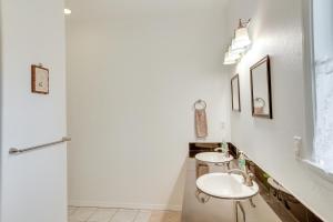 a bathroom with two sinks and a shower at Paradise Park Vacation Rental about 4 Mi to Shoreline! in Keaau