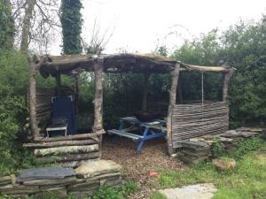 a gazebo with a grill and a chair and a table at Horsemans Stargazing Tent in Kingsbridge +6 photos