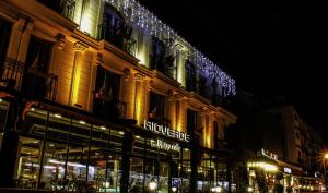 un edificio con luces de Navidad encima en PREMIUM INN City Hotel & Restaurant Central Shopping Street Location !, en Famagusta
