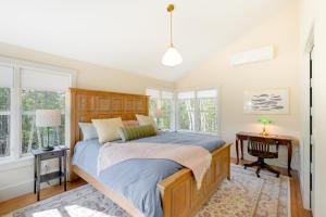 A bed or beds in a room at Stunning Seal Cove Home Near Acadia National Park!