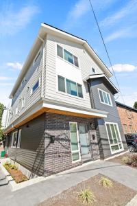 a large white house on a street at Bodhi's sweet suite - Micro Studio - 91Walkscore in Seattle