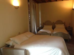 En eller flere senge i et værelse på Agriturismo Da Luca
