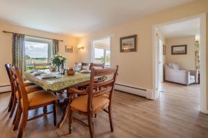 a dining room with a table and chairs at Majors Lodge in Watlington