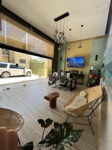 a living room with a couch and a dining room at LOL-HA Hotel Boutique in Cancún