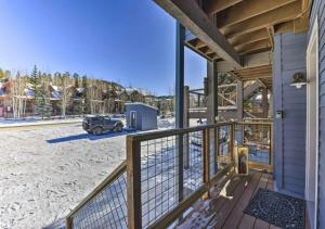 a porch of a house with a truck parked in the snow at Main Street Breck, Walk Everywhere! in Breckenridge