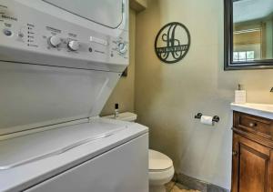 a bathroom with a white toilet and a sink at Main Street Breck, Walk Everywhere! in Breckenridge