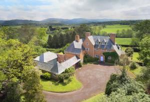 an aerial view of a large house in the countryside at Dolbelidr in St Asaph
