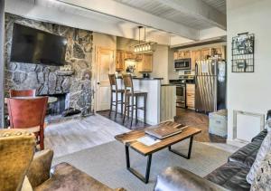 a large living room with a stone wall at Main Street Breck, Walk Everywhere! in Breckenridge