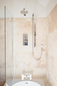 a bathroom with a shower and a sink at Strathallan Bed and Breakfast in Grantown on Spey