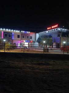 a night view of a main hospital with lights at POP 80511J Palki Hotel And Marriage Palace in Singhāna