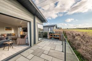 a patio with a view of a house at 14 Westgate in Burnham Market