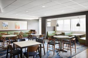 a restaurant with tables and chairs in a room at Fairfield Inn & Suites by Marriott El Paso Airport in El Paso