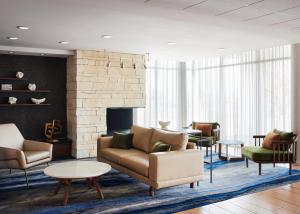 a living room with furniture and a fireplace at Fairfield Inn & Suites by Marriott El Paso Airport in El Paso