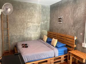 Postel nebo postele na pokoji v ubytování Koh Mak Homestay