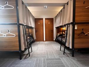 a hostel room with bunk beds in it at Urban Pack in Hong Kong