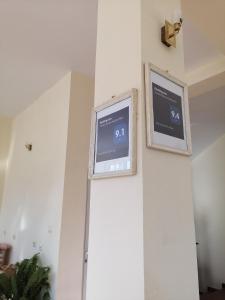 a clock on the wall of a room at Mechta Family Hotel in Obzor